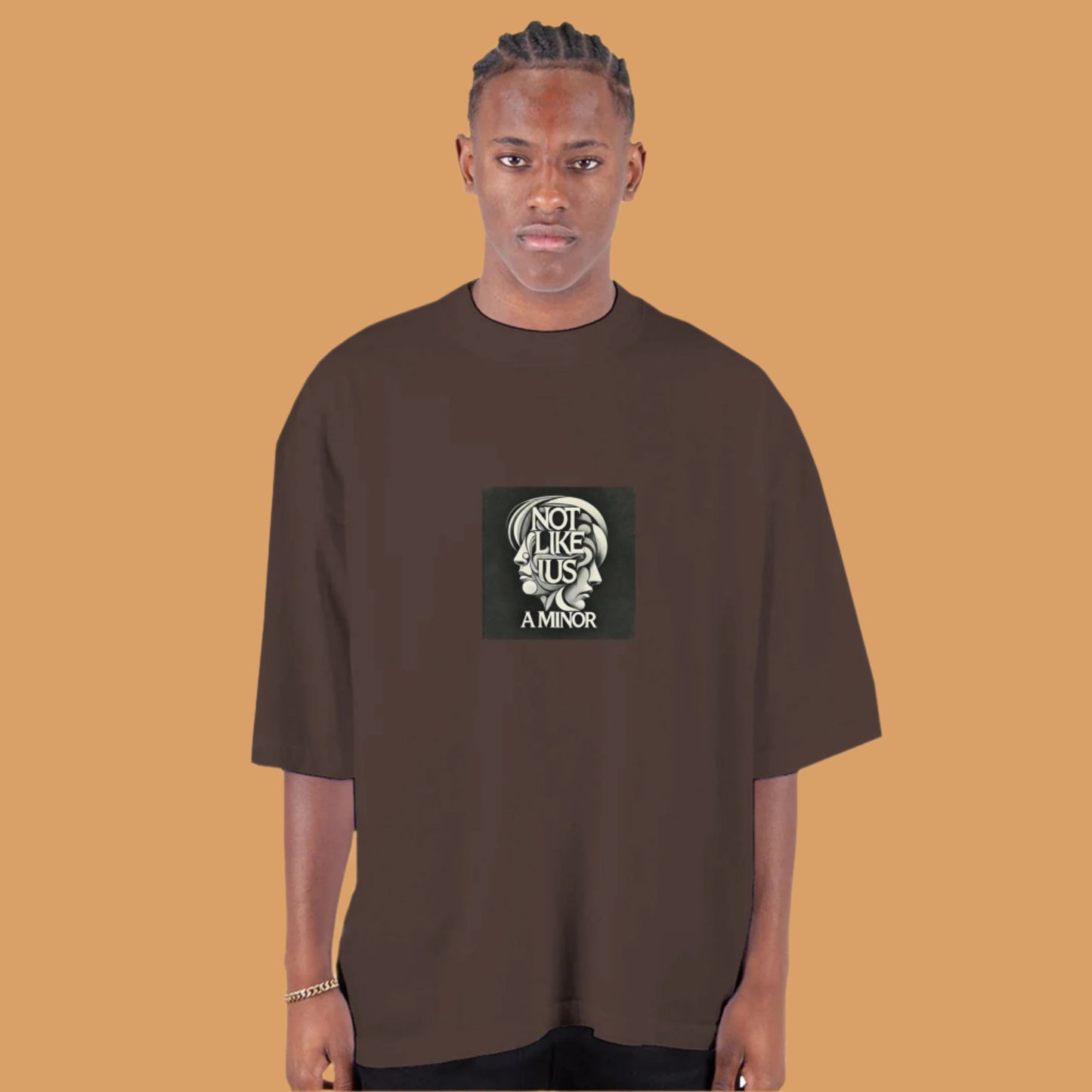 Brown oversized T-shirt with not like us a minor black printed on the chest tan background