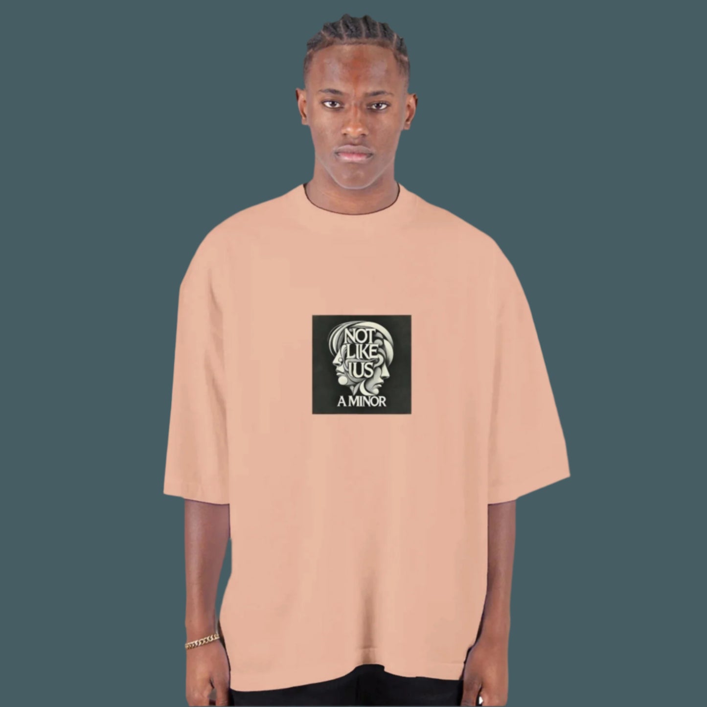 Peach oversized T-shirt with not like us a minor black printed on the chest cobalt blue background