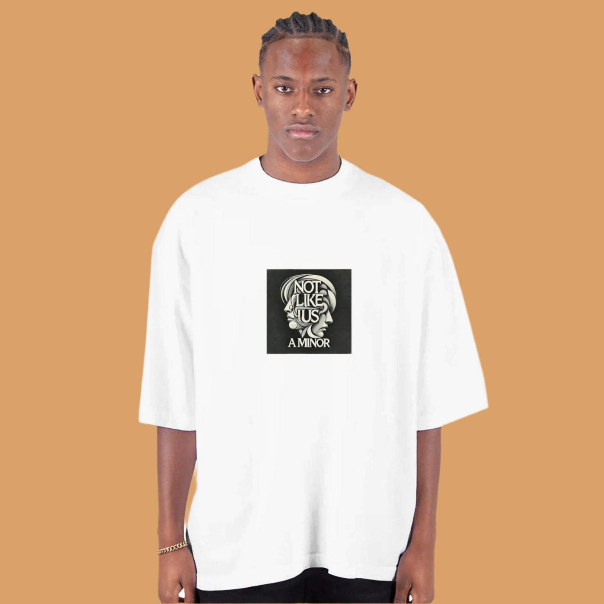 White over sized T shirt with not like us a minor black printed on the chest tan background